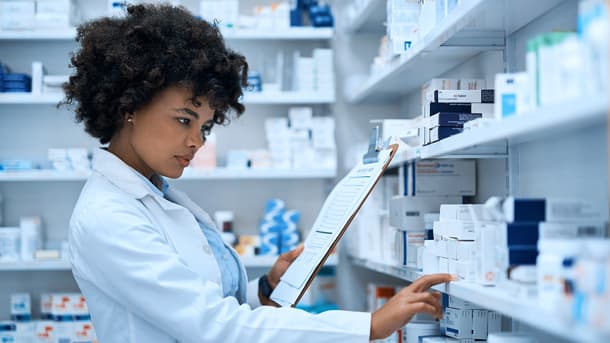 Pharmacist looking over inventory
